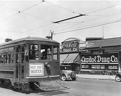 Streetcar in Denver that says help save water. 