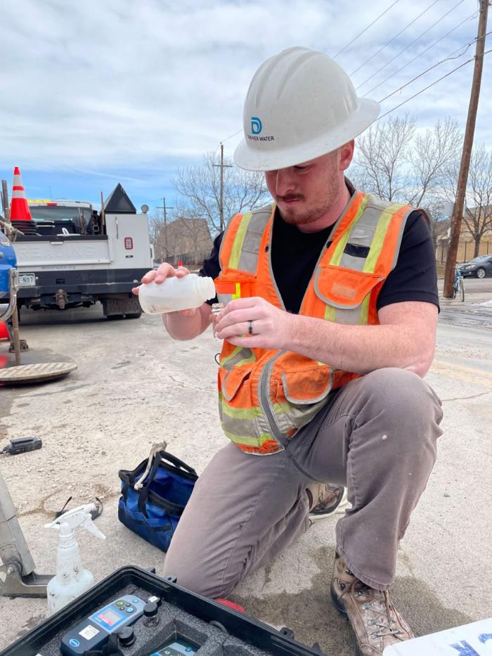 Man tests water sample