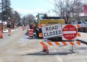 Road closed due to traffic barricade while Denver Water works