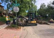Denver Water crews dig up portions of street and a customer's yard to begin lead service line replacement.