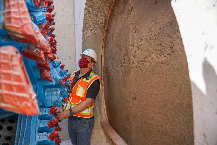 David Wilson, engineer, checks out the cutting blade of the tunnel boring machine.