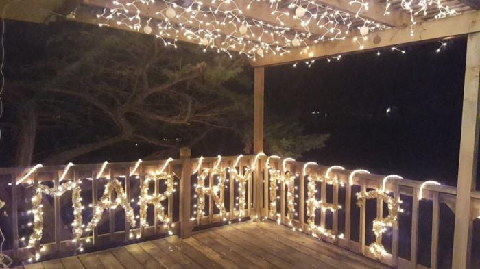 After taking Casey on a holiday lights tour around her hometown of Omaha, Nebraska, Counter had one more stop on the tour — where an important question was spelled out in lights on the back porch of her home: “Marry me?” The two were engaged on Christmas of 2017. Photo credit: Kait Counter.