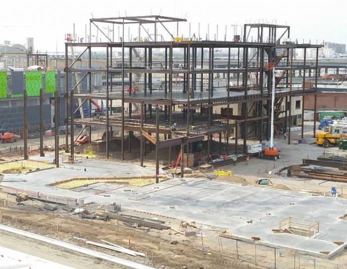 Steel beams form the skeleton of a large, new building.