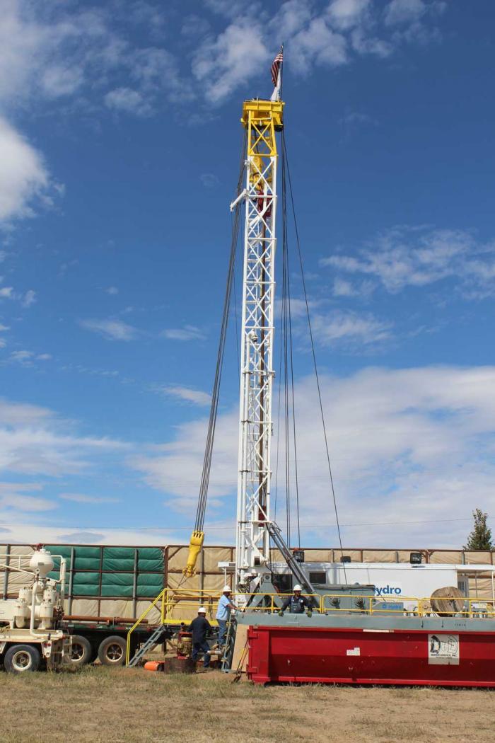 Drilling rig that pumps treated water underground into aquifers.  