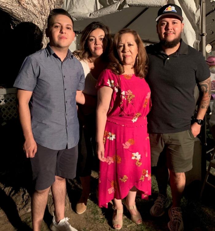 Cris Villalba with his mother and siblings