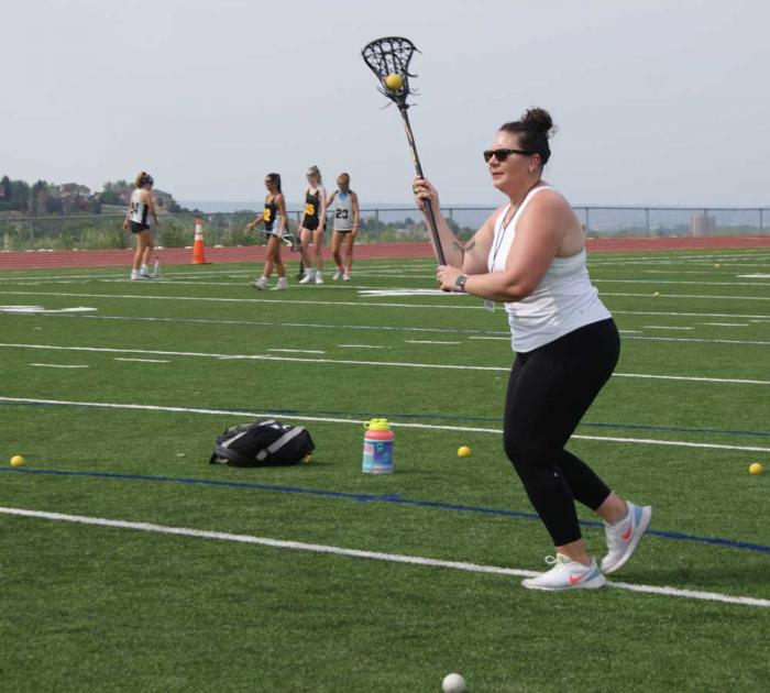 Woman playing lacrosse