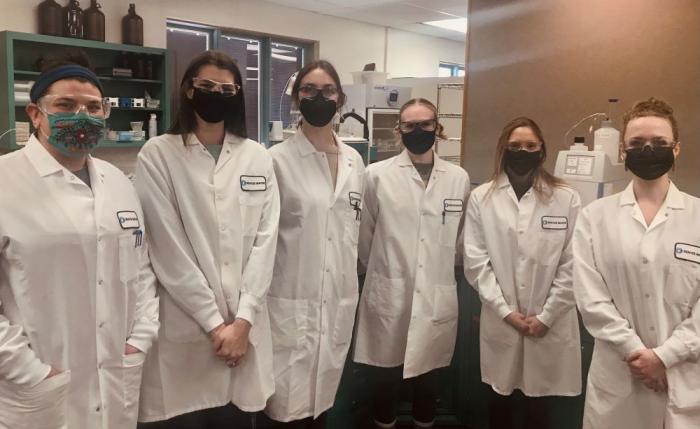 Group photo of female scientists in a lab