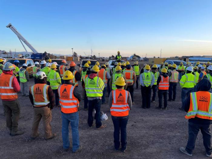 Dozens of people at a safety meeting