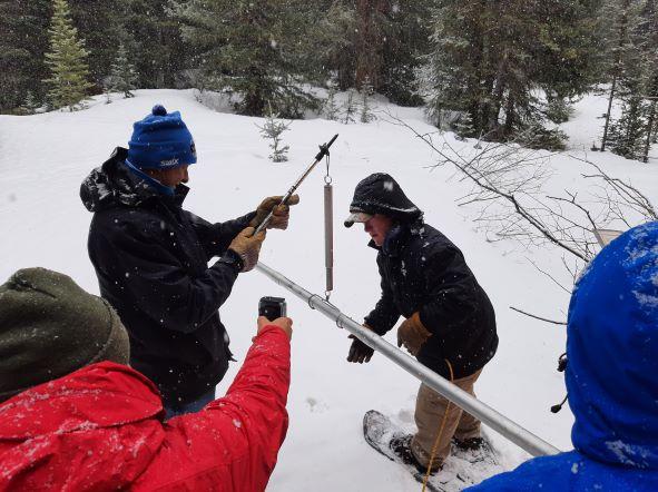 Crews weigh a snow tube