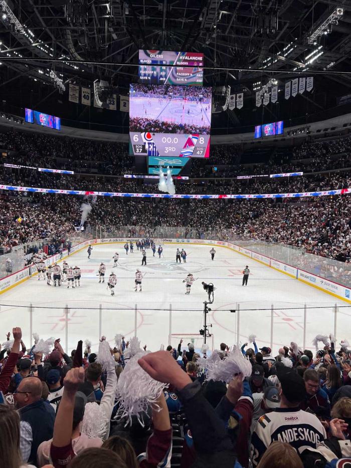 The crowd cheers the end of a hockey game as the players skate off the ice and the scoreboard signals an Avalanche win with the Avalanche 8, Edmonton Oilers 6, on May 31, 2022
