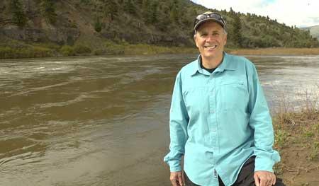 Jim Lochhead standing next to Colorado River
