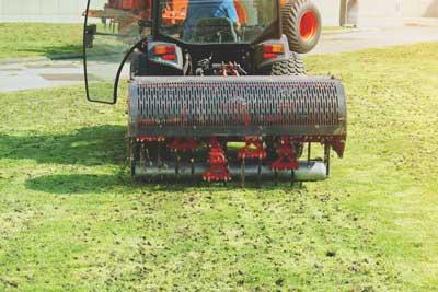 Aerator in operation on lawn