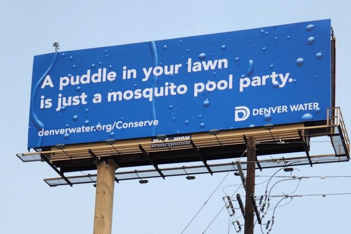 A billboard that reads: A puddle in your lawn is just a mosquito pool party.