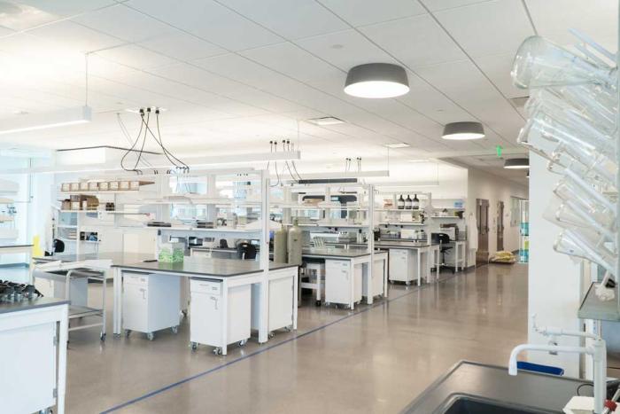 A laboratory space filled with equipment and shelves.