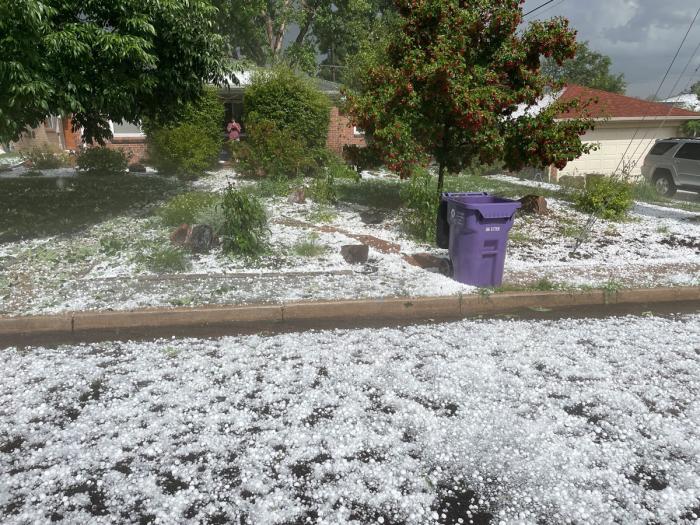 Hail covers a Denver Water yard like a winter snow. 