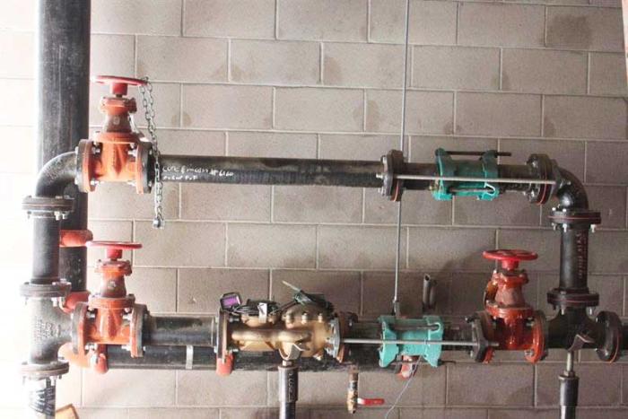 water pipes and meter for a large commercial building located in a basement or large vault