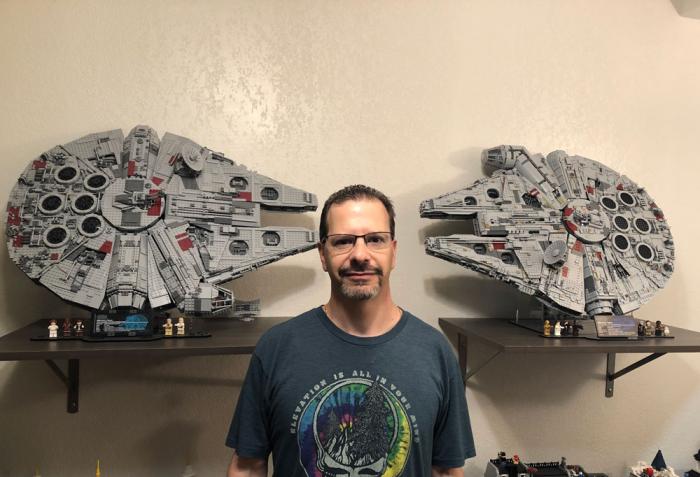 Man stands in front of two Lego Star Wars ships