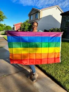 Tami Berry holding a pride flag