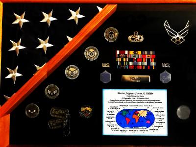 Steve Holder’s insignia and awards from his 20 years of service in the U.S. Air Force, including a map showing where he served.