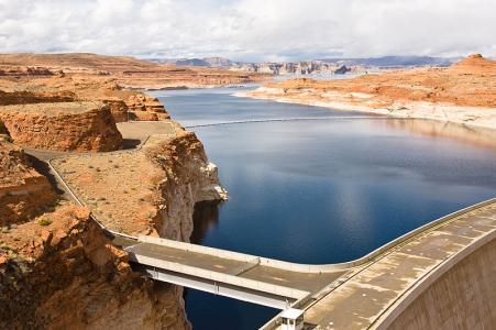 Lake Powell acts as a sort of savings account for upper-basin states in the Colorado River to store water to send to the lower-basin states. The lighter-colored rock, or "bathtub ring" shows how levels at Lake Powell continue to drop dramatically. Photo credit, Adam Kliczek, Creative Commons.