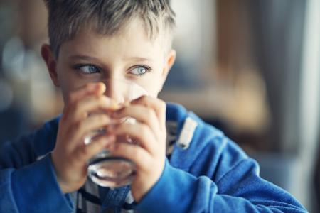 Child drinking glass of water