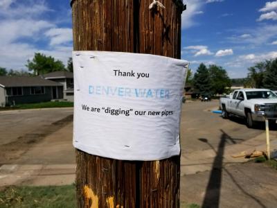 sign stapled to a telephone pole