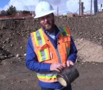 Cian Davis, a corrosion engineering specialist at Denver Water, shows a corrosion hole on a water pipe.
