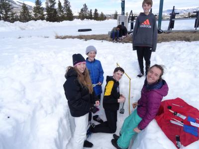Students measuring snowpack