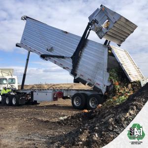 A fresh load of compostable materials is added to the windrows at A1 Organics' facility northeast of Denver.