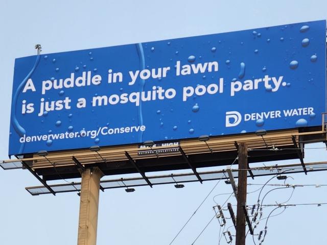 A billboard that reads "A puddle in your lawn is just a mosquito party." 
