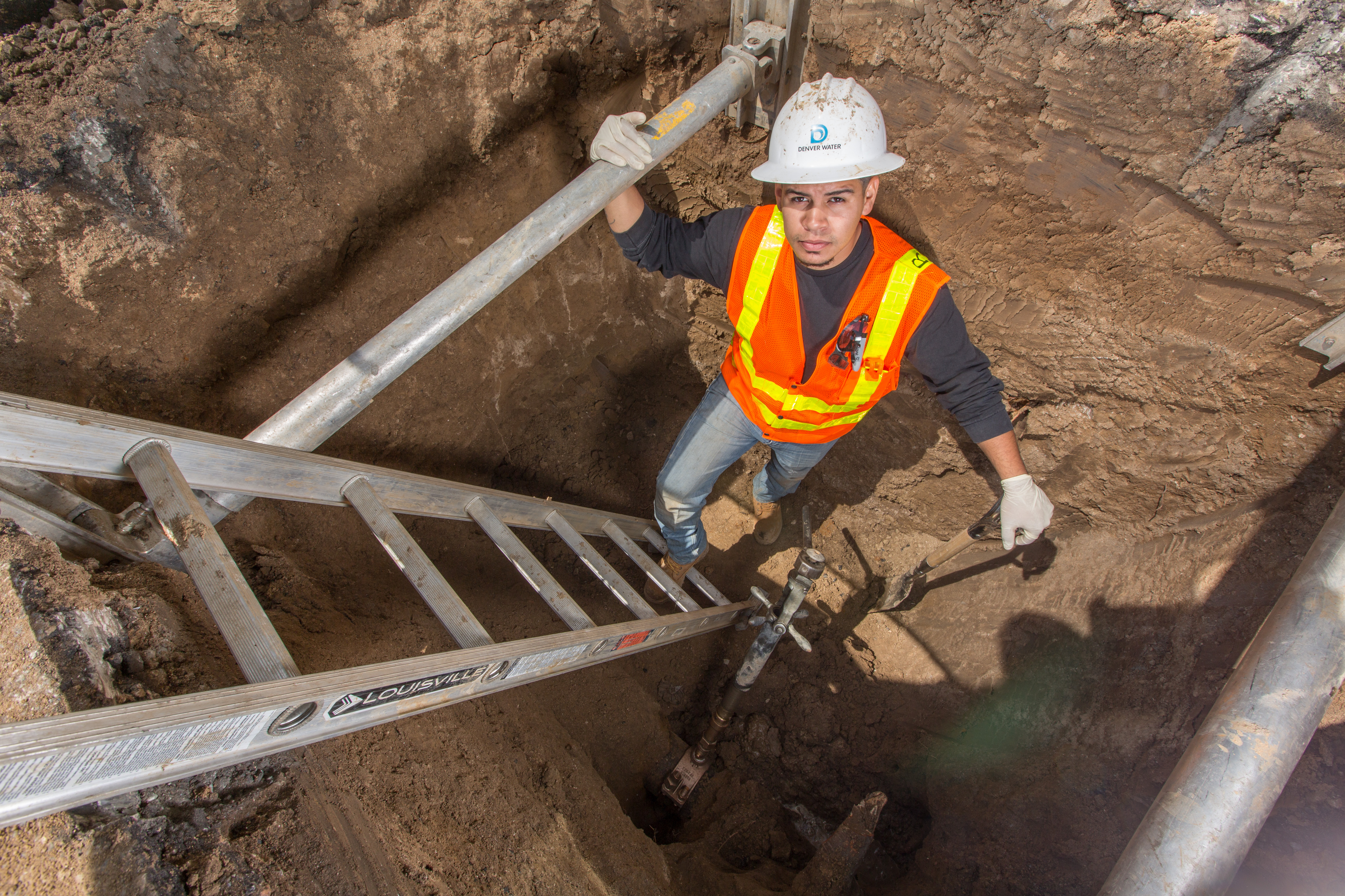 senior utility technician Daniel Ruvalcaba fixes a leak underground
