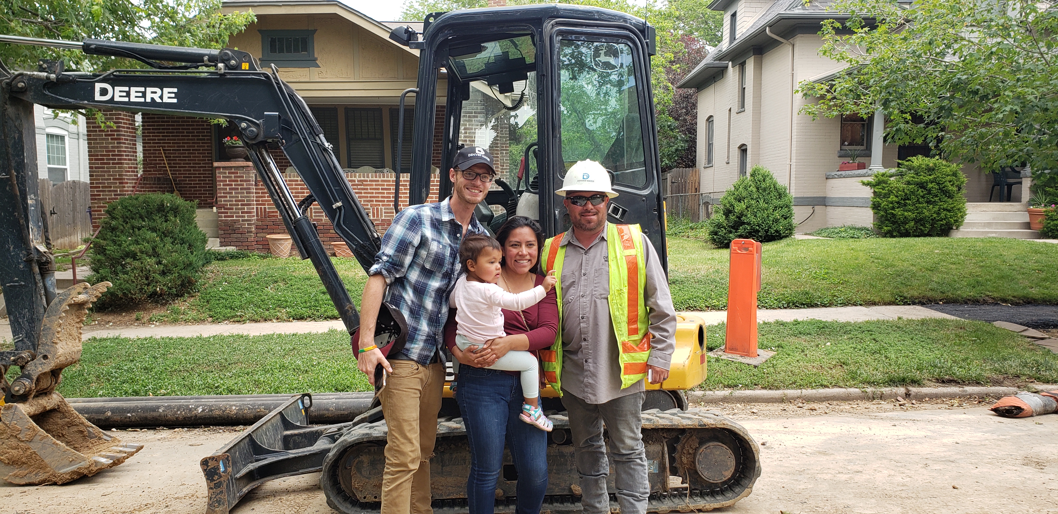 Zooey and her parents stop by a Denver Water project and meet Billy Martinez, Denver Water equipment operator. 
