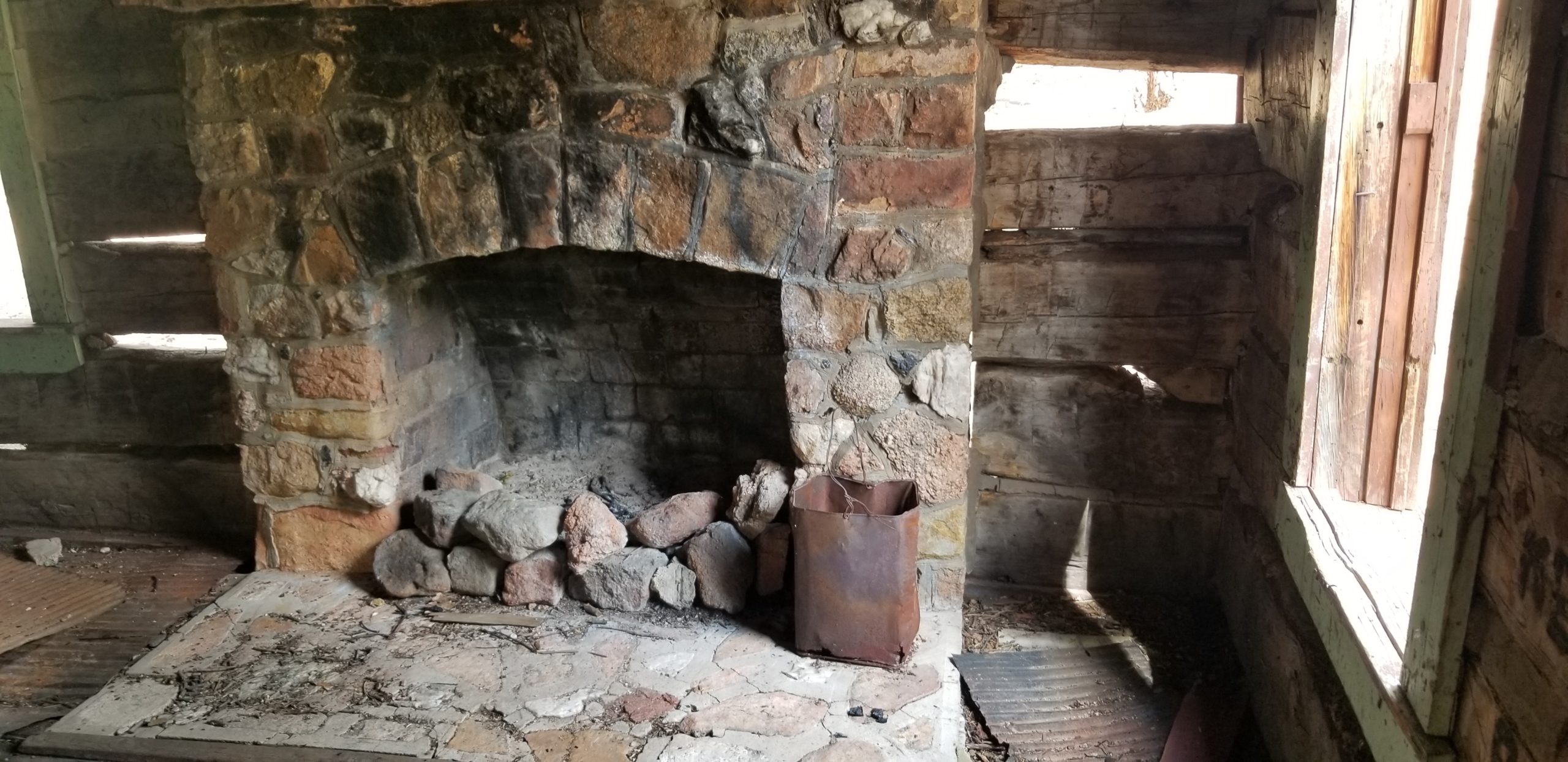The interior of one of the old cabins at the Lost Park Reservoir site. You can imagine some nightcaps around the fireplace. Photo credit: Denver Water.