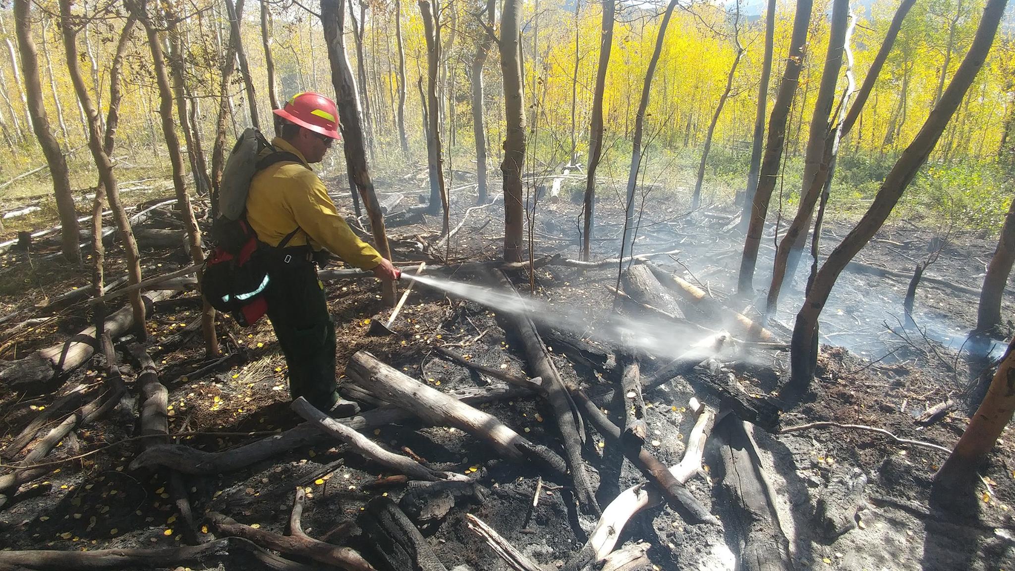 Firefighters hiked up Tenderfoot Mountain to hose down hotspots. Photo courtesy: Lake Dillon Fire and Rescue.