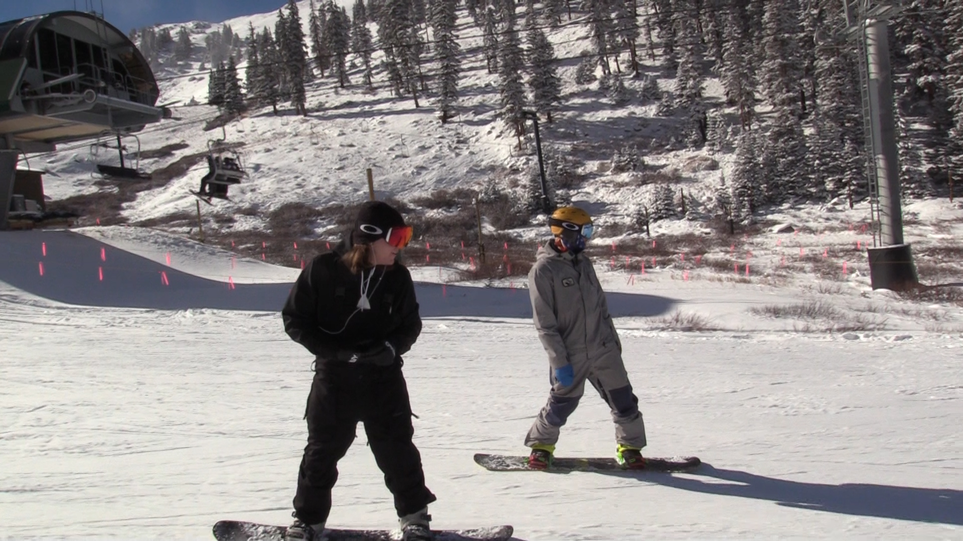 Two snowboarders at A-Basin