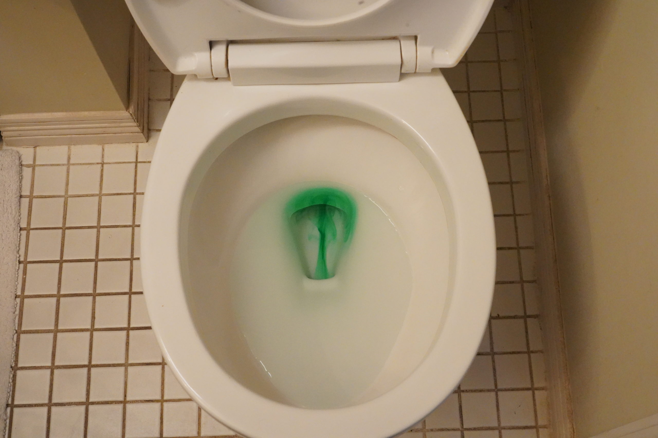 Placing a few drops of food coloring in a toilet's tank will leak into the bowl if there is a leak in the flapper. Photo credit: Denver Water.