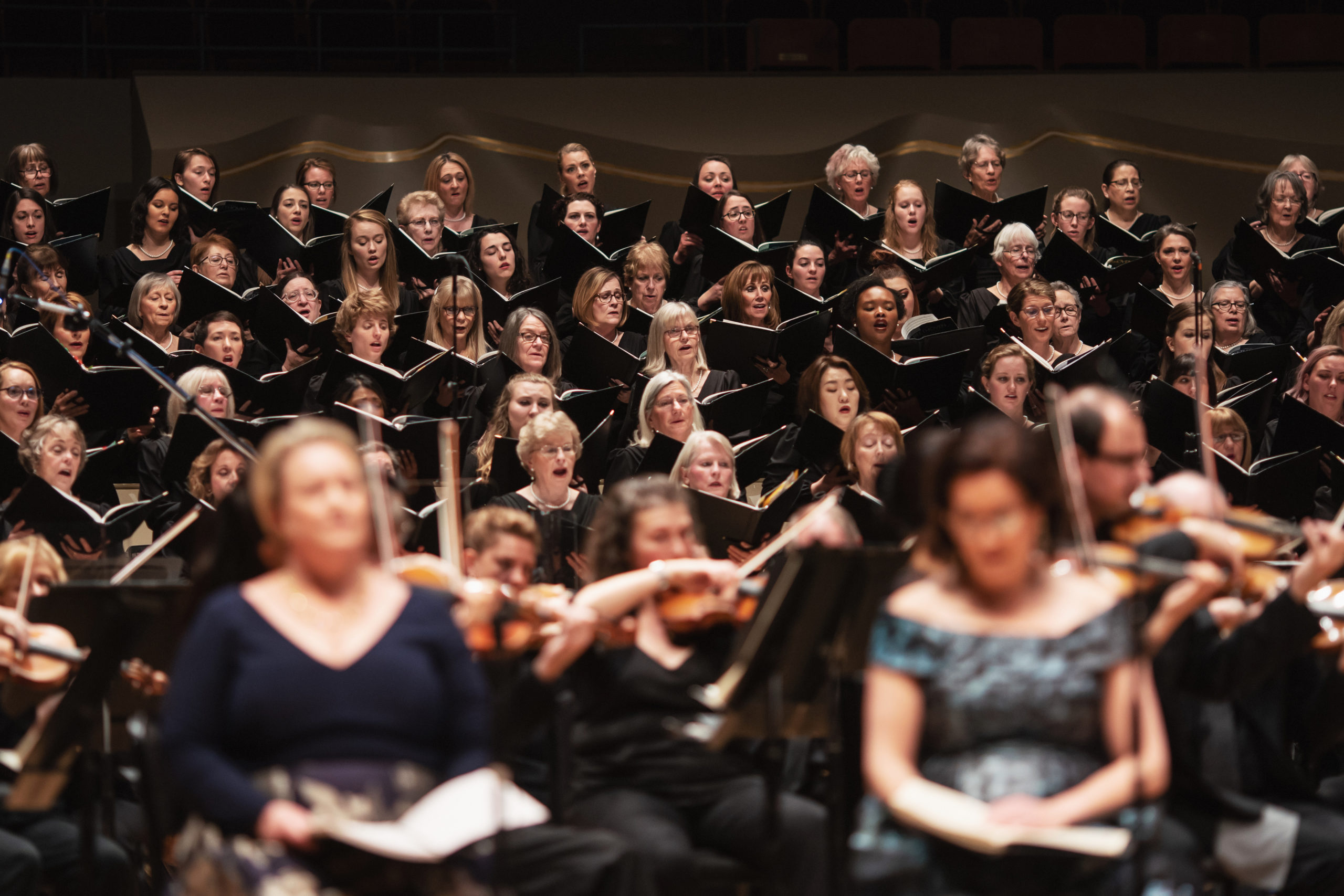 Alex Bowen (third row of vocalists, third from left) sings with the Colorado Symphony in February 2020. Photo credit: Amanda Tipton Photography.