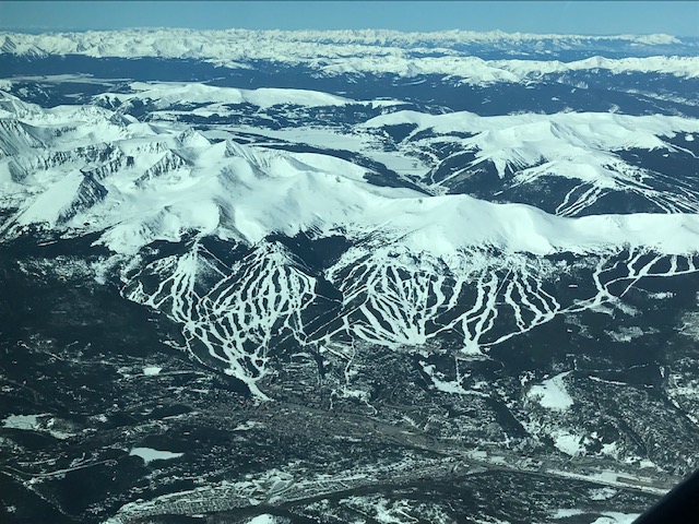 A network of ski runs marks the mountains.