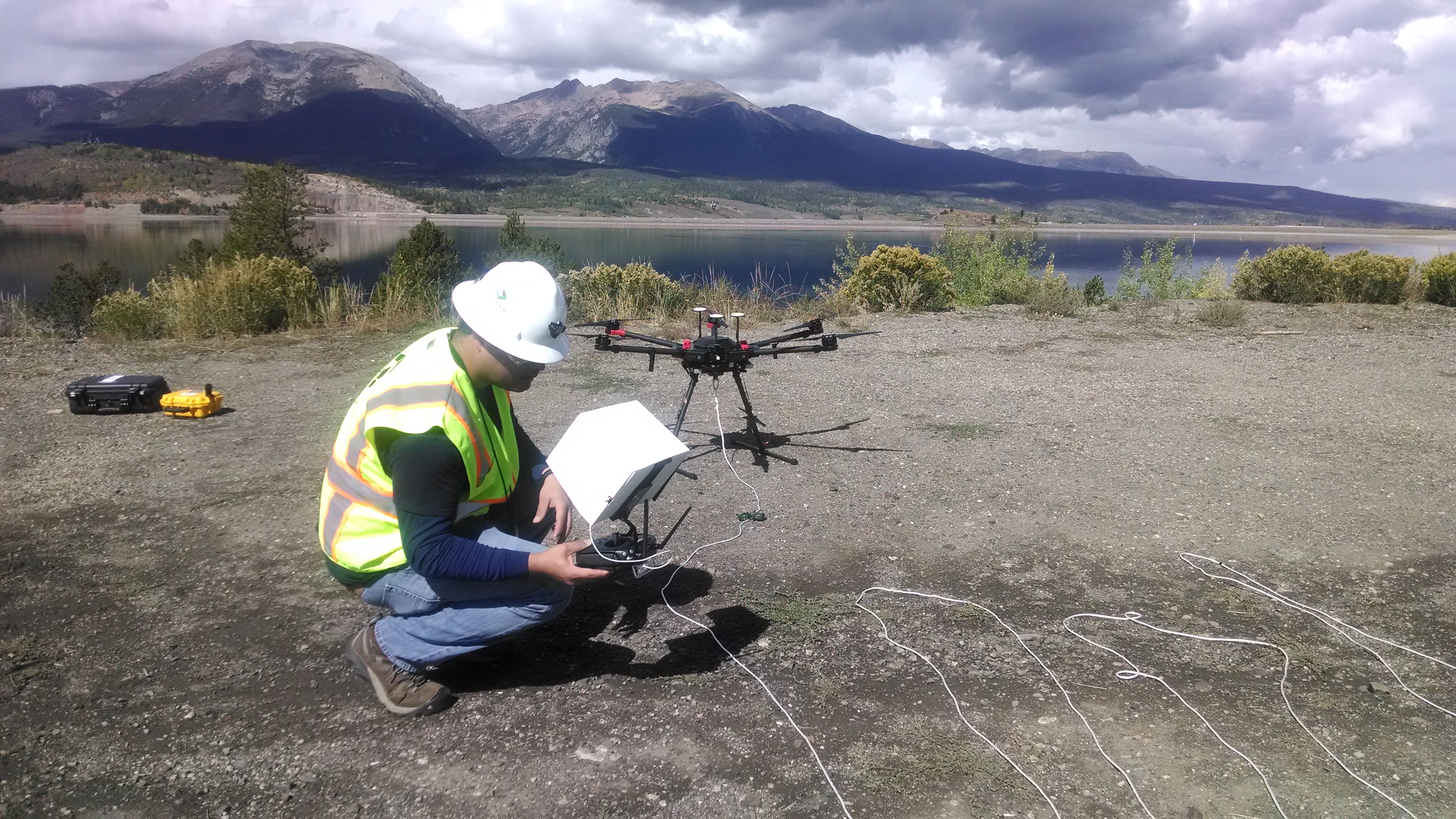 A team member from Golder Associates Inc. readies a drone for a test flight to collect water samples from Dillon Reservoir.