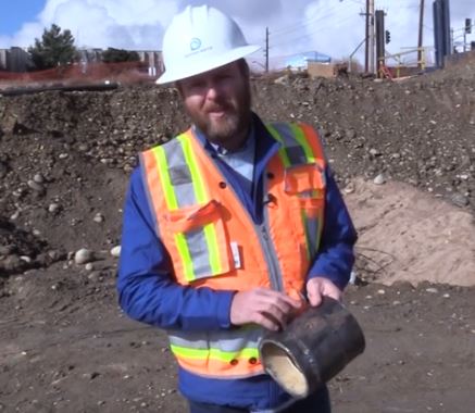 Cian Davis, a corrosion engineering specialist at Denver Water, shows a corrosion hole on a water pipe.