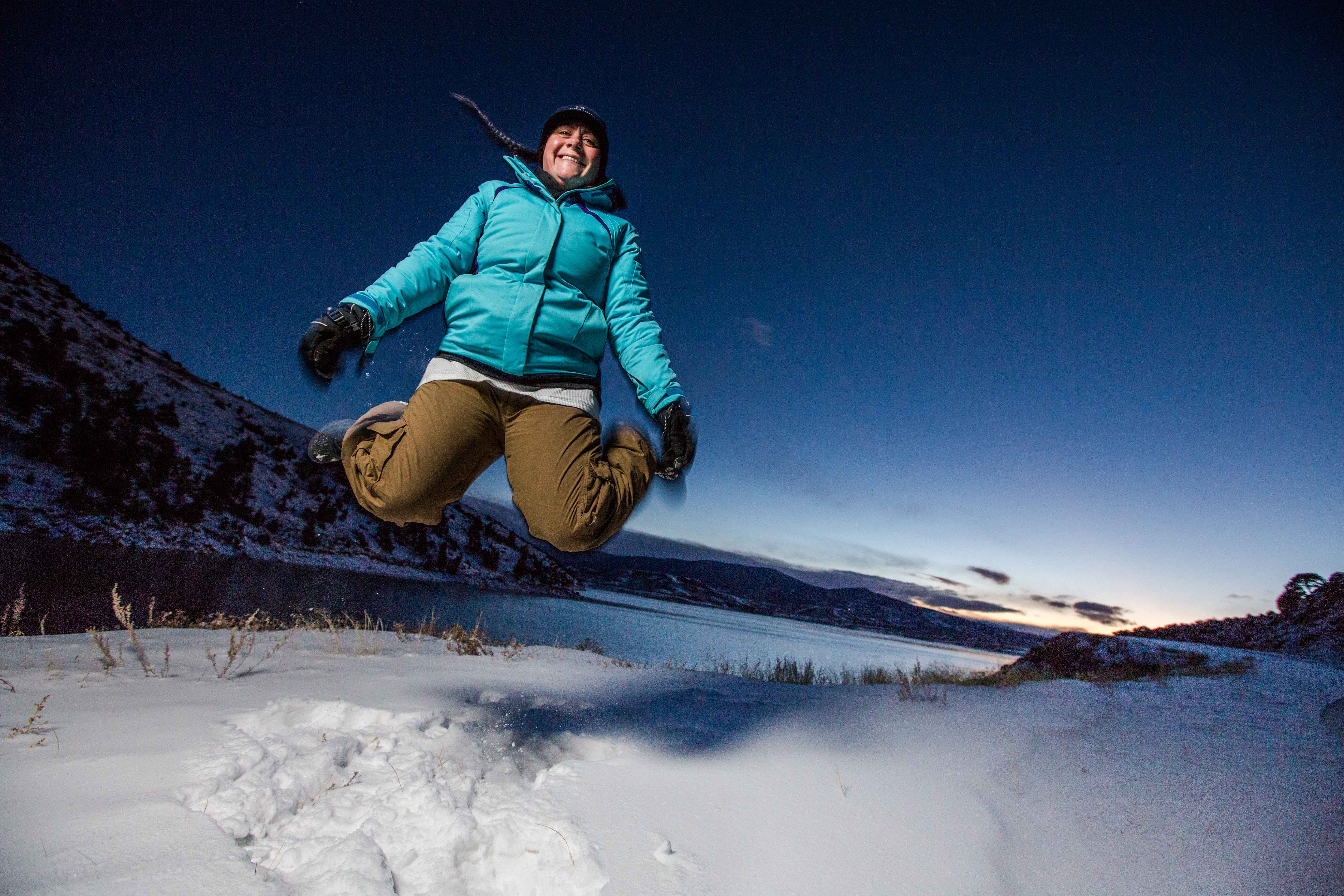 Jessica Mahaffey jumping for joy at Williams Fork Reservoir