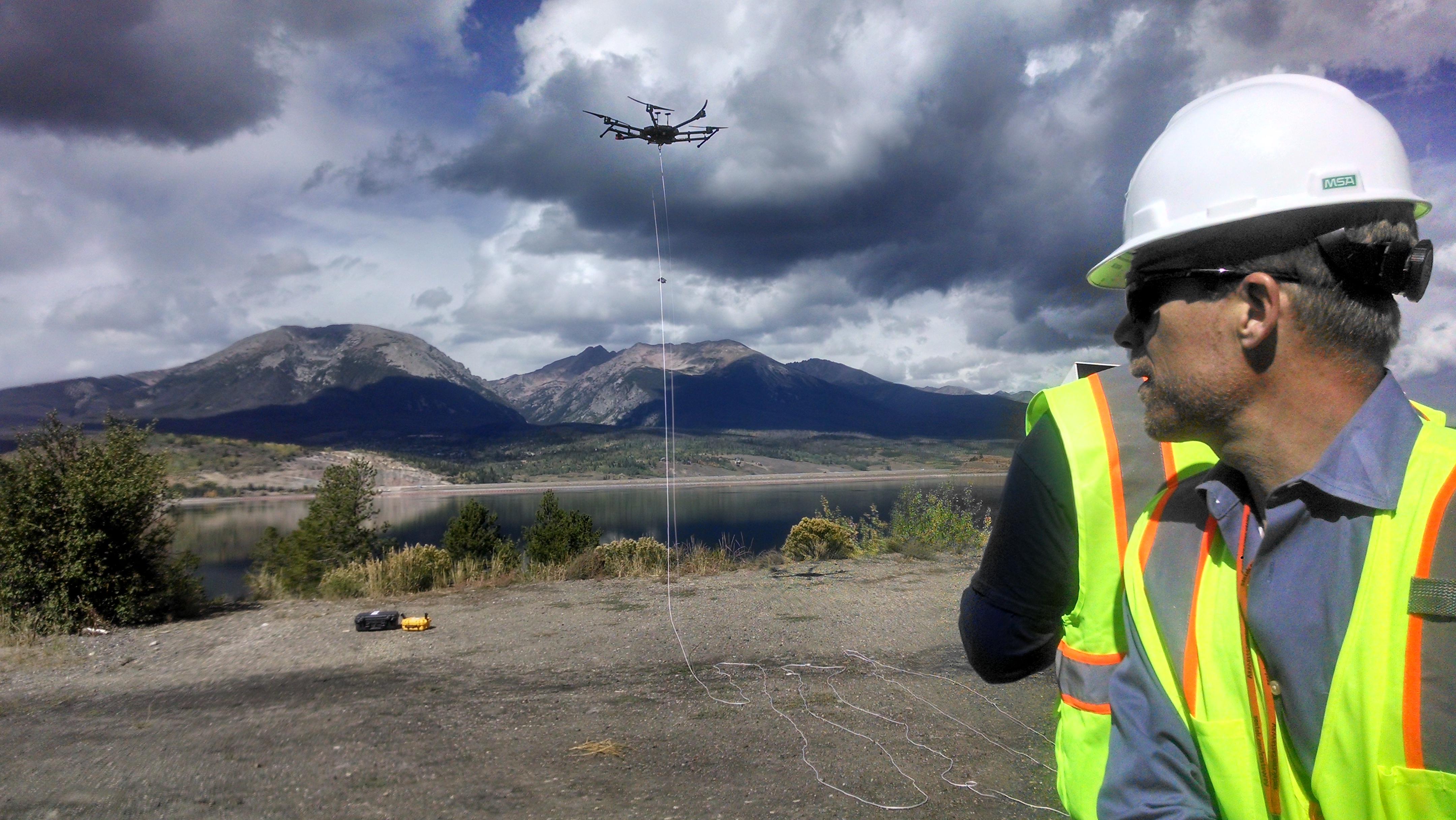 Devin Castendyk, a senior geochemist with Golder Associates Inc., watches a test flight of drone capable of collecting water samples from the depths of Dillon Reservoir.