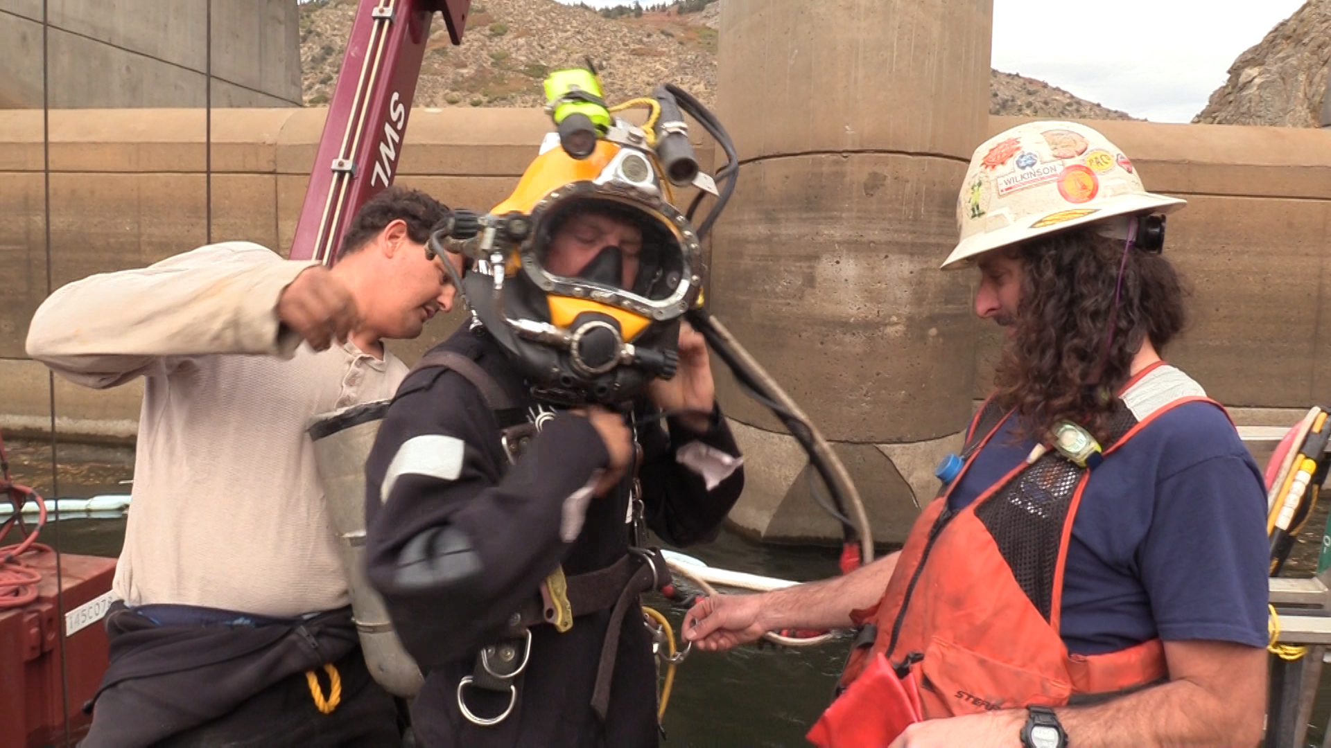 Nathan Pierce gets ready to dive into Strontia Springs Reservoir to install a bulkhead on to the side of the dam 200 feet below the surface.