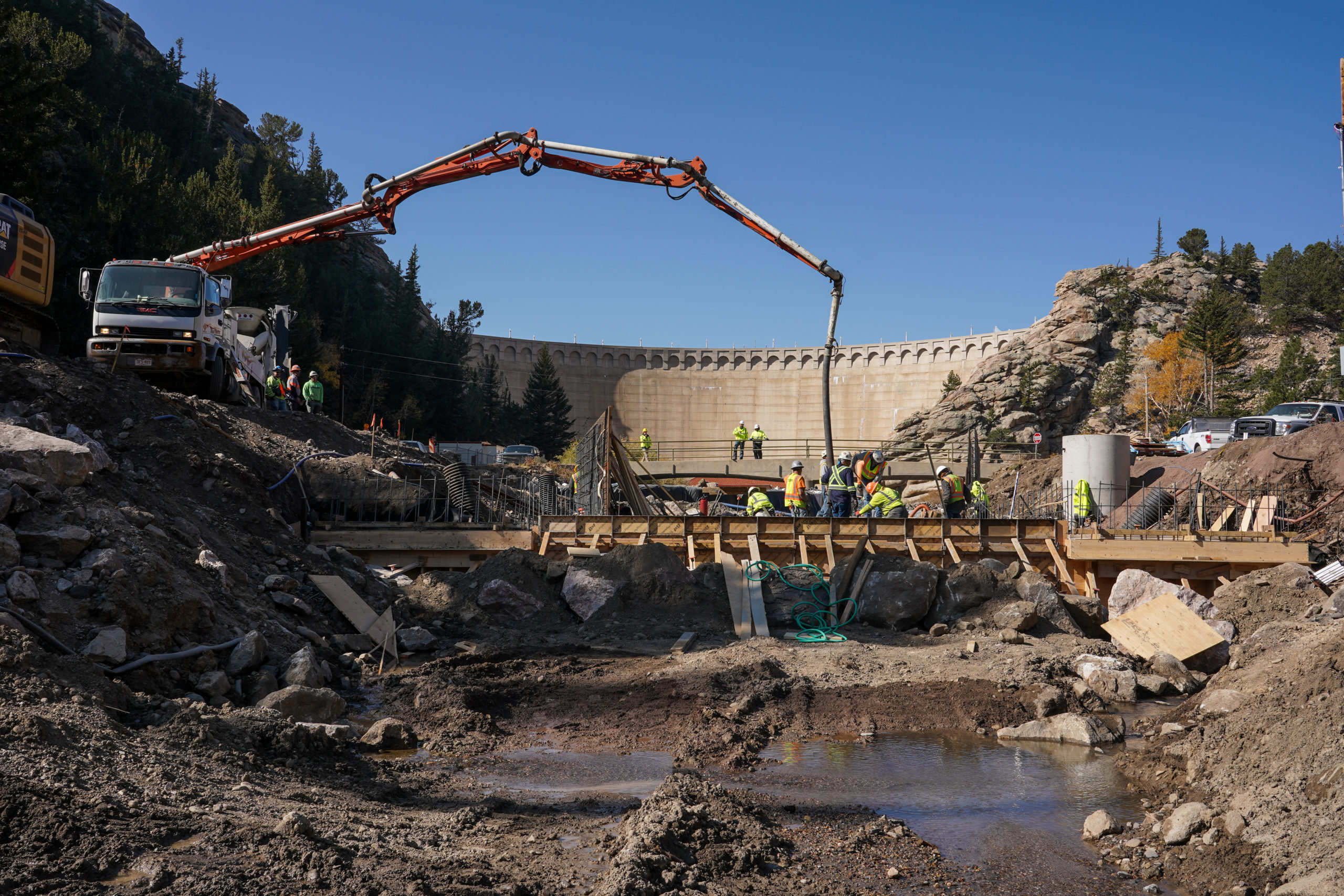 Workers construct the new flume on the downstream side of the dam in October 2020. Photo credit: Denver Water.