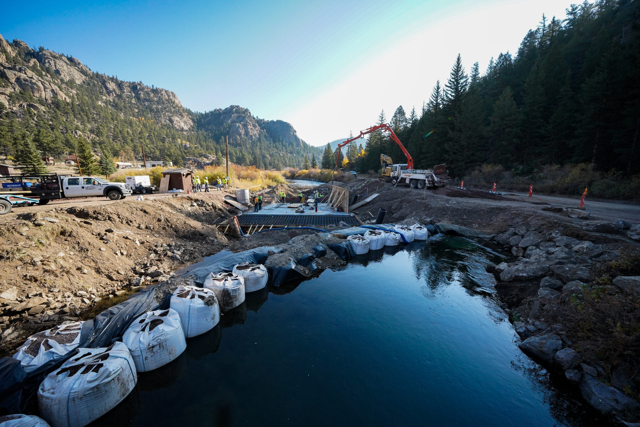 Workers built a temporary dam made of sandbags to divert water around the work area. Photo credit: Denver Water.