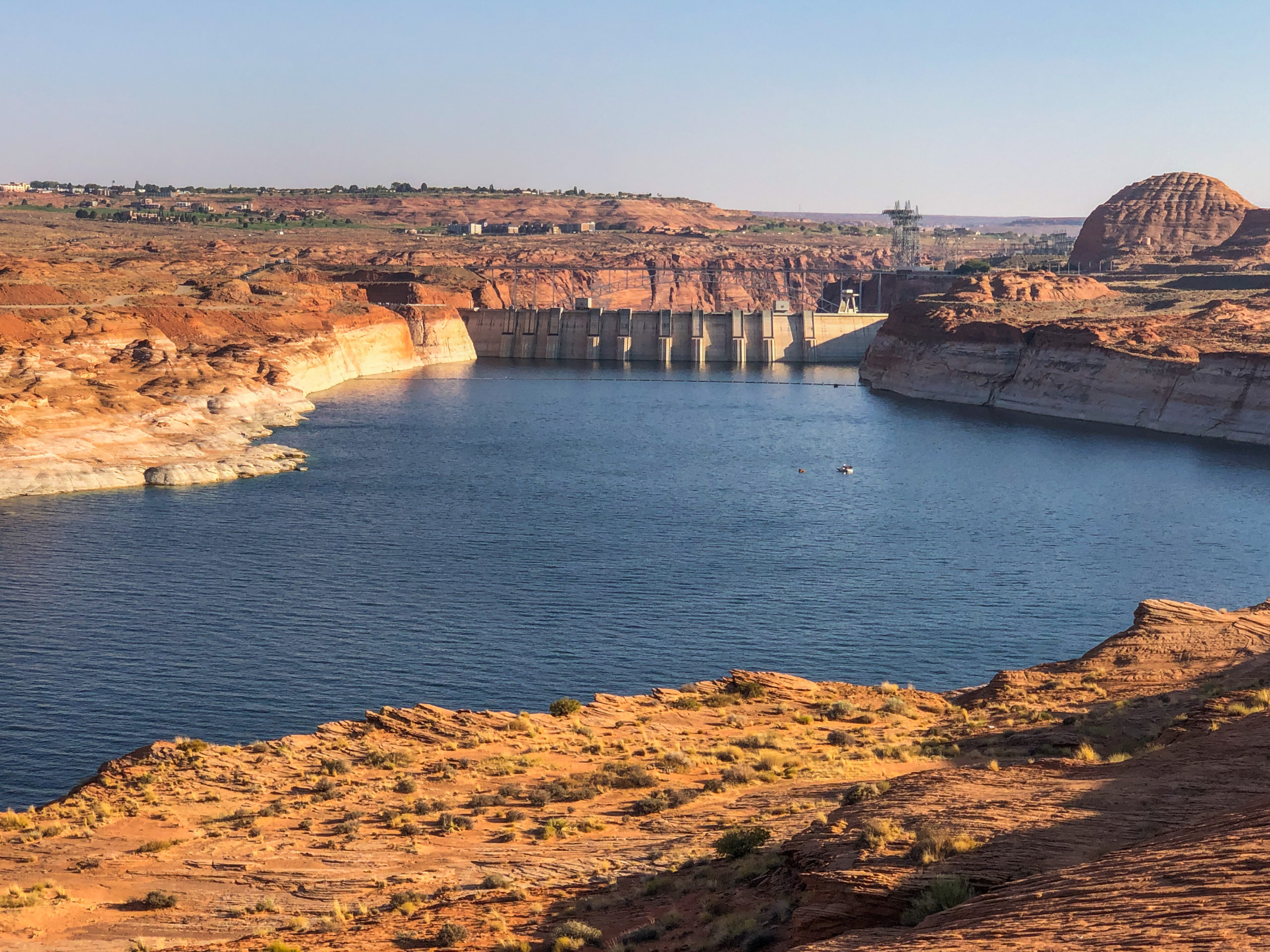 Glen Canyon Dam with the town of Page, Arizona, in the upper left. Lake Powell was at 46% of capacity on Sept. 30 after dropping 19 feet during the previous 12 months. The last time the lake was full was in 1987, but the reservoir levels remained at near full capacity through the late 1990s. Photo credit: Denver Water.