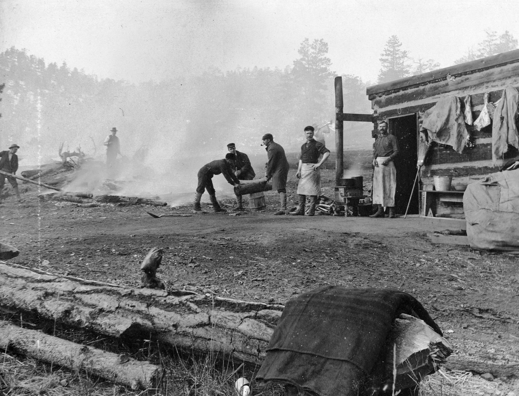 Because their shovels could only do so much, crews had to burn the ground to defrost it before they could dig down to build the foundation of a cabin at Lake Cheesman in 1896.
