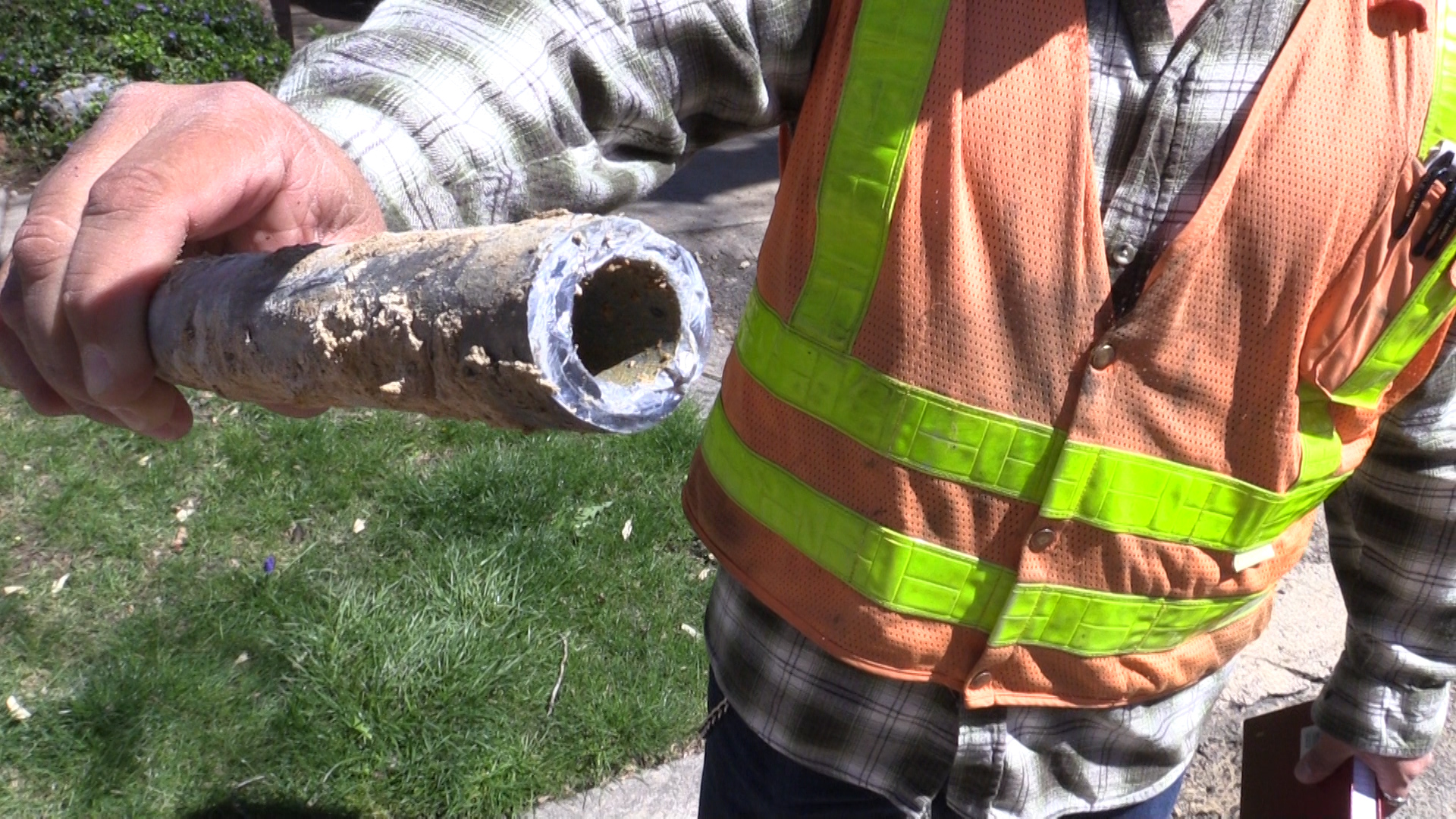 An old lead service pipe dug out of the ground.