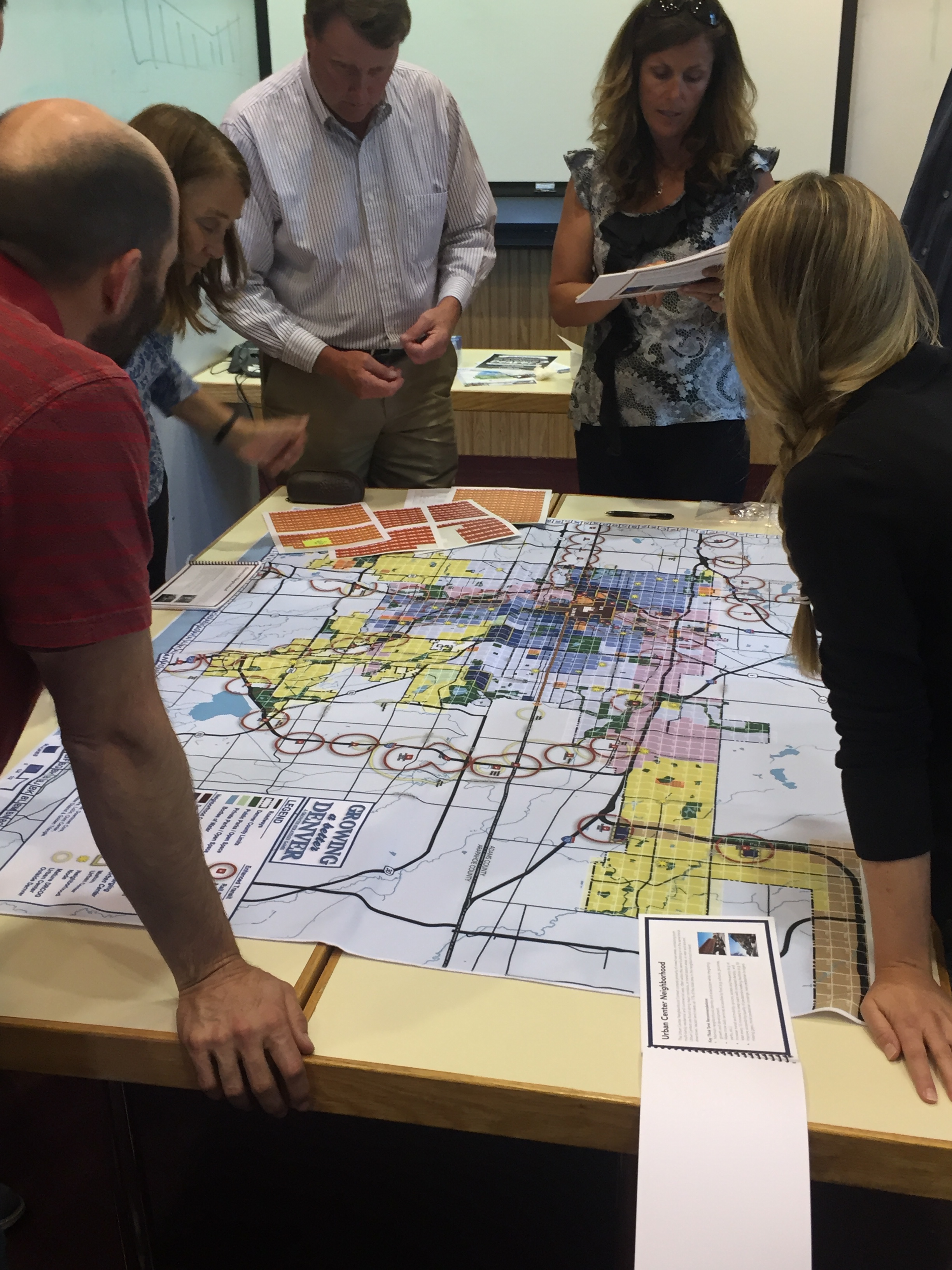 Denver Water planners play "Growing a better Denver game" developed by Denveright to help communicate, educate and make decisions on citywide land use and transportation planning.