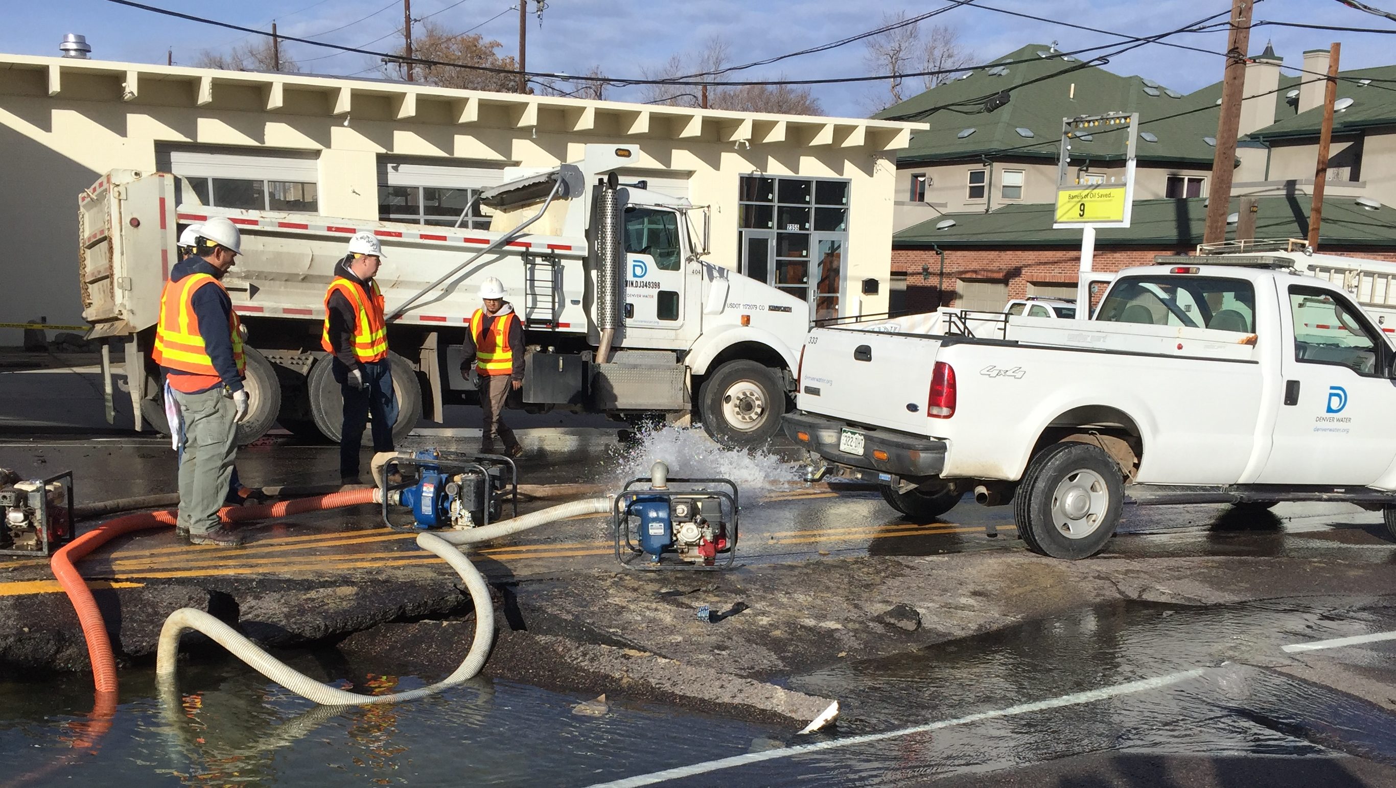 A Denver Water crew drains water from a hole caused by a 24-inch-diameter conduit break before repairing the pipe that ruptured in the Highlands on Jan. 28, 2017.